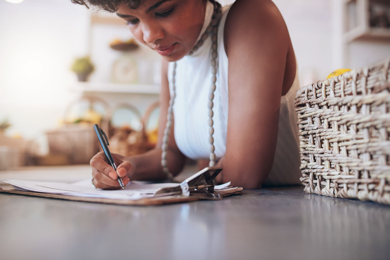 Young african woman working in a juice bar