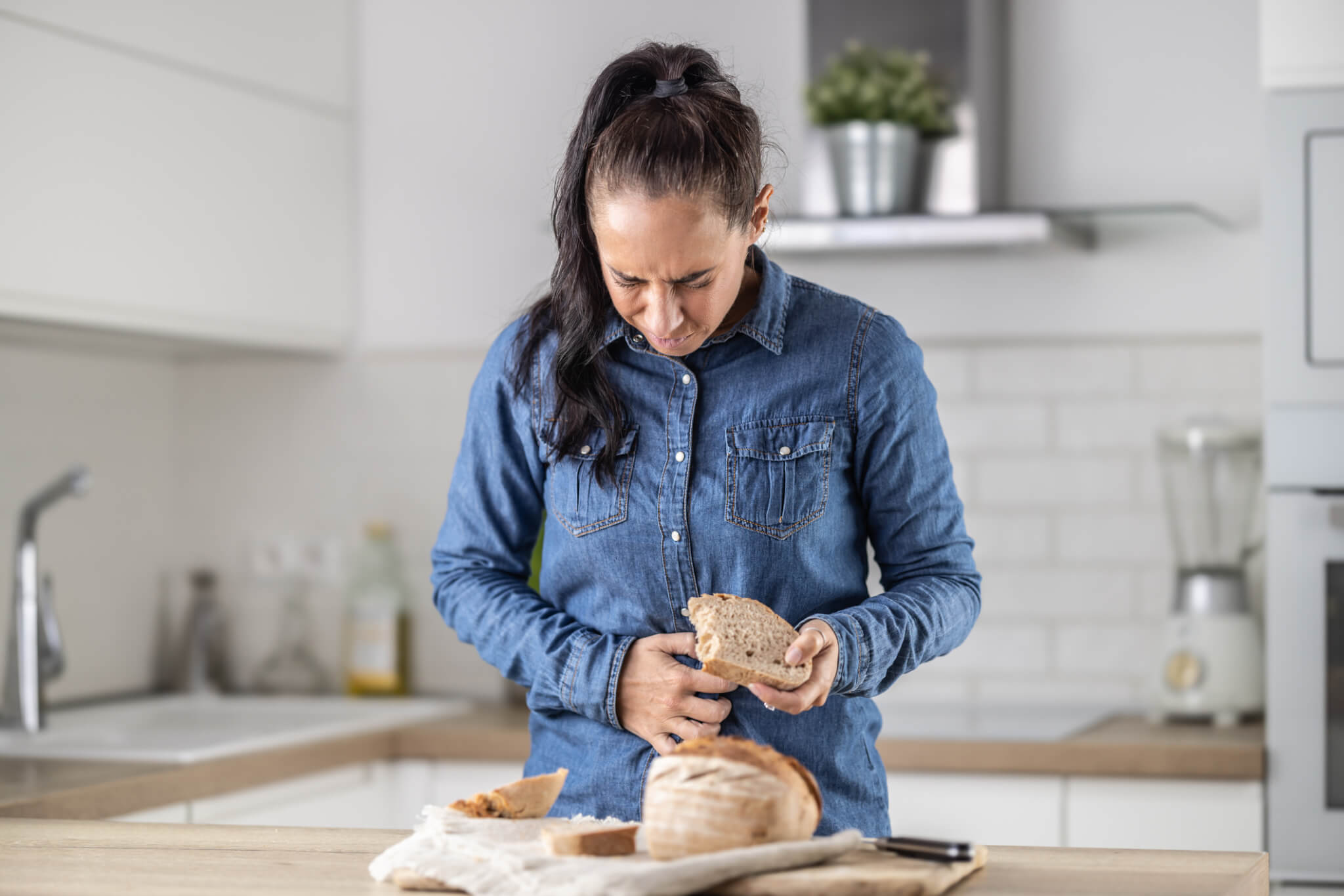 Woman suffering from signs and symptoms of celiac disease